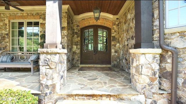 doorway to property featuring french doors and ceiling fan