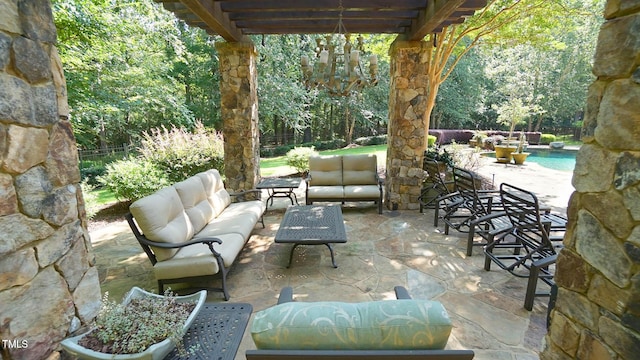 view of patio with a pergola and an outdoor hangout area