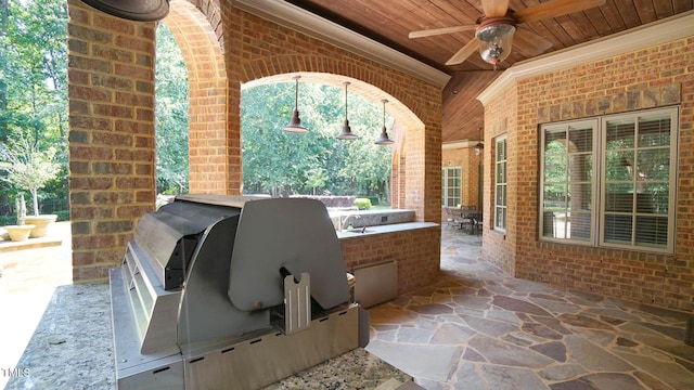 view of patio / terrace with area for grilling and ceiling fan