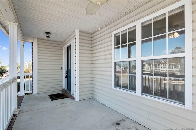 exterior space featuring ceiling fan