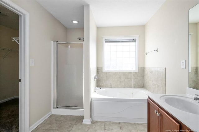 bathroom with vanity, tile patterned floors, and separate shower and tub