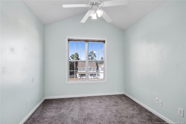 carpeted spare room with vaulted ceiling and ceiling fan