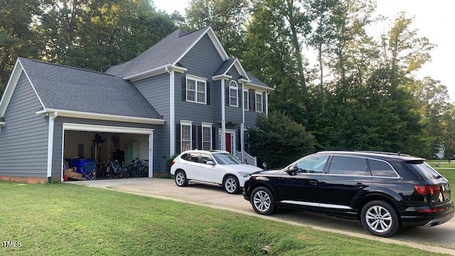 view of side of home featuring a garage and a lawn