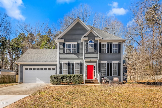 view of front of property featuring a garage and a front yard