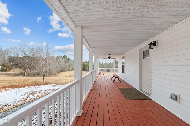 deck with a porch and ceiling fan