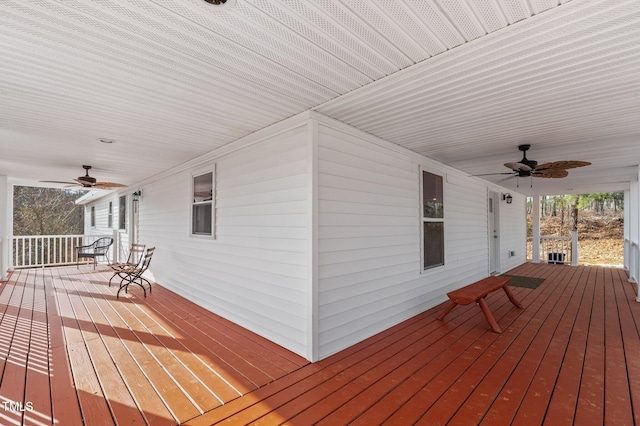 deck with ceiling fan and covered porch