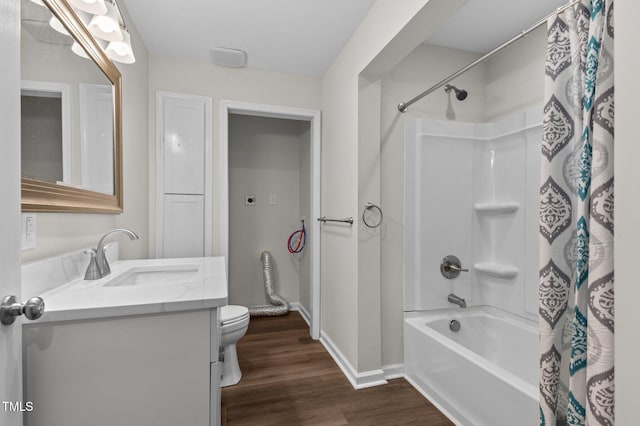 full bathroom with wood-type flooring, vanity, shower / bath combo with shower curtain, and toilet