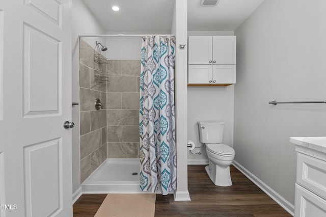 bathroom featuring a shower with curtain, vanity, toilet, and hardwood / wood-style floors