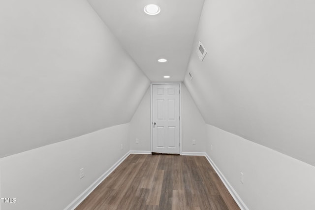 additional living space with lofted ceiling and wood-type flooring