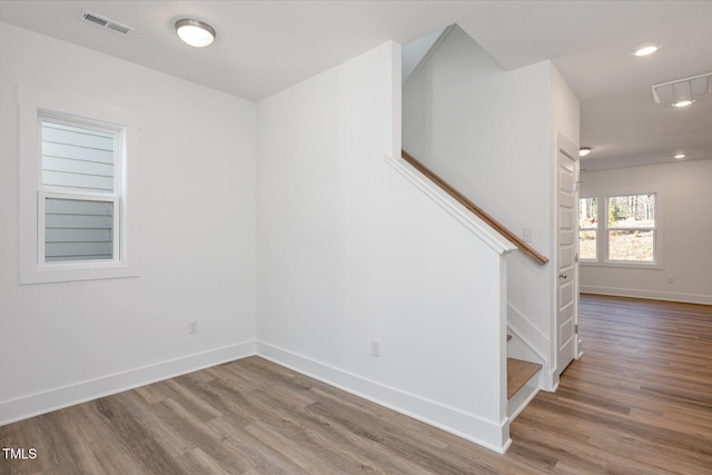 staircase featuring hardwood / wood-style floors