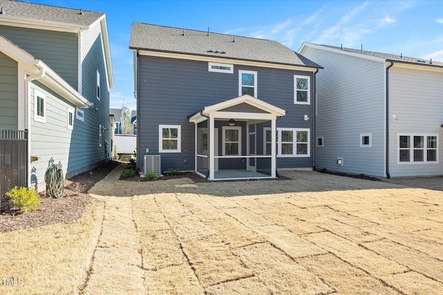 back of house with a patio and a sunroom