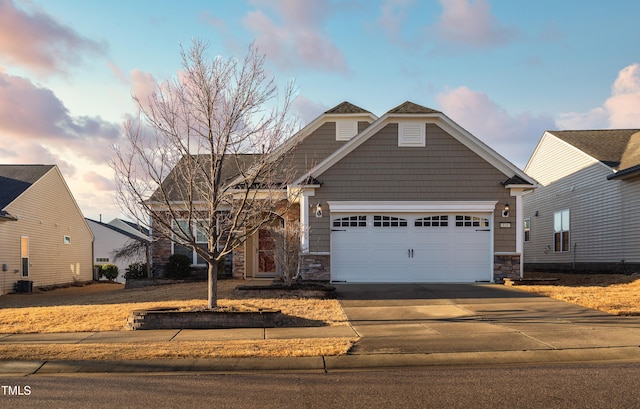 craftsman-style home with a garage and central AC