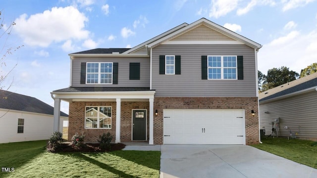 view of front of house with a garage and a front yard