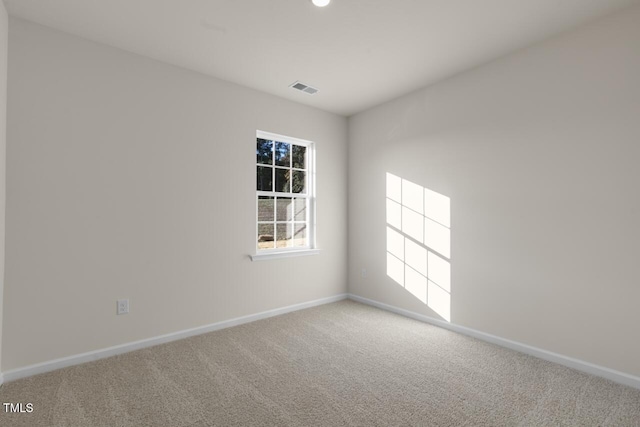 unfurnished room featuring carpet floors