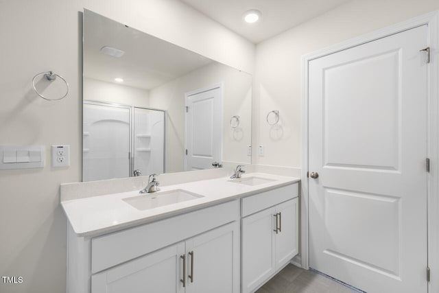 bathroom with vanity and an enclosed shower