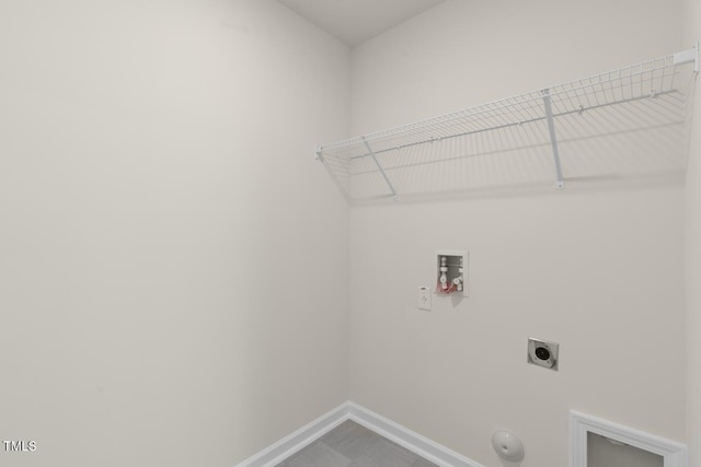 washroom with gas dryer hookup, electric dryer hookup, and washer hookup