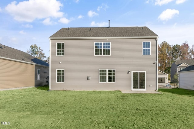 rear view of house featuring a patio and a lawn