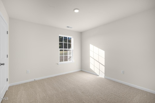 spare room featuring carpet flooring