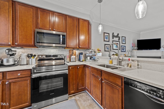 kitchen featuring sink, stainless steel appliances, tasteful backsplash, ornamental molding, and decorative light fixtures