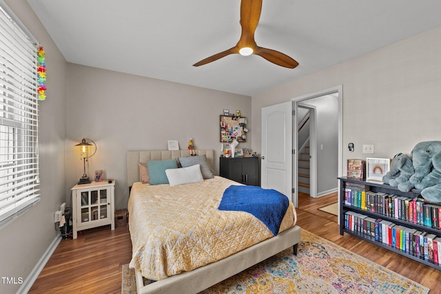 bedroom featuring ceiling fan and wood-type flooring