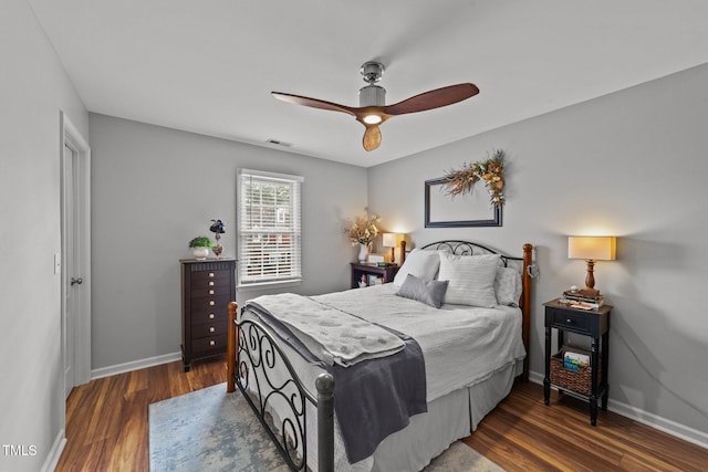 bedroom featuring dark hardwood / wood-style flooring and ceiling fan