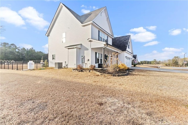 view of property exterior with central AC