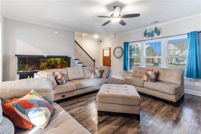 living room with dark hardwood / wood-style flooring, crown molding, and ceiling fan