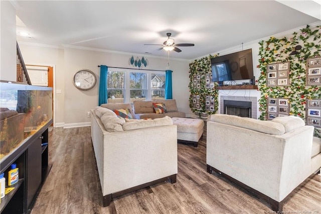 living room featuring crown molding, a brick fireplace, and dark hardwood / wood-style flooring