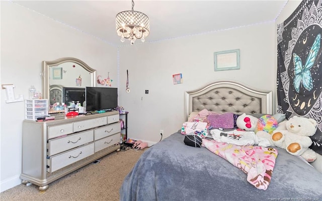 bedroom featuring light colored carpet and a chandelier