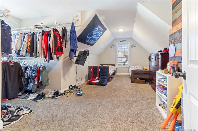 interior space with vaulted ceiling and carpet