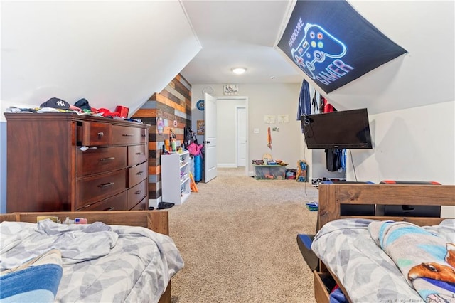 bedroom with lofted ceiling and carpet flooring