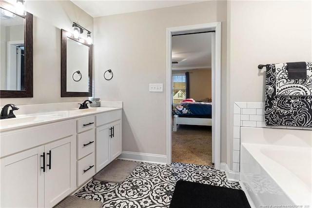 bathroom featuring tile patterned floors, vanity, and a tub