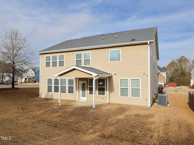 rear view of house featuring central air condition unit and a patio area