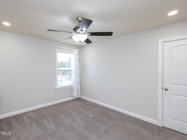 empty room featuring carpet and ceiling fan