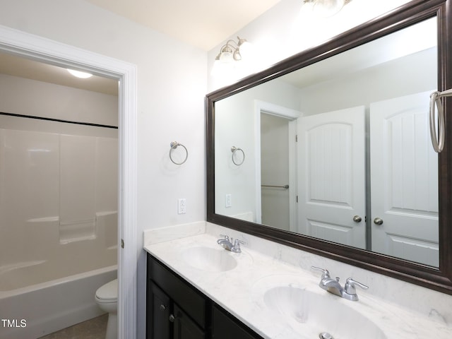 full bathroom featuring vanity, shower / tub combination, and toilet