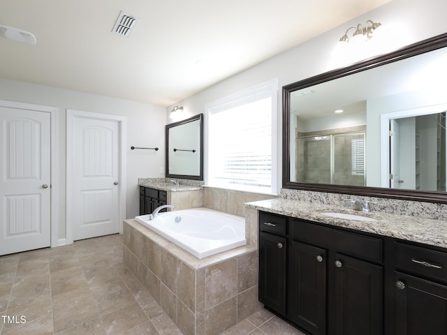 bathroom with vanity and plus walk in shower