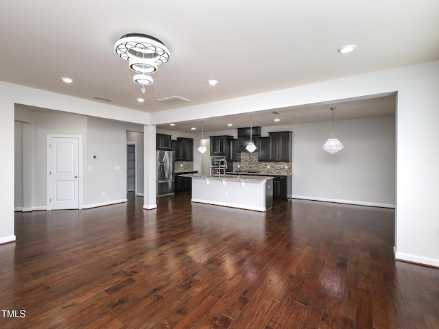 unfurnished living room with dark hardwood / wood-style flooring