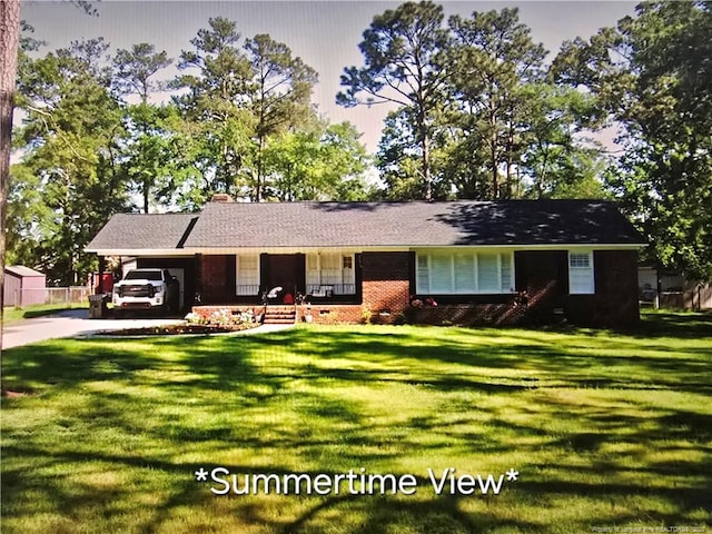 ranch-style house with a carport and a front yard