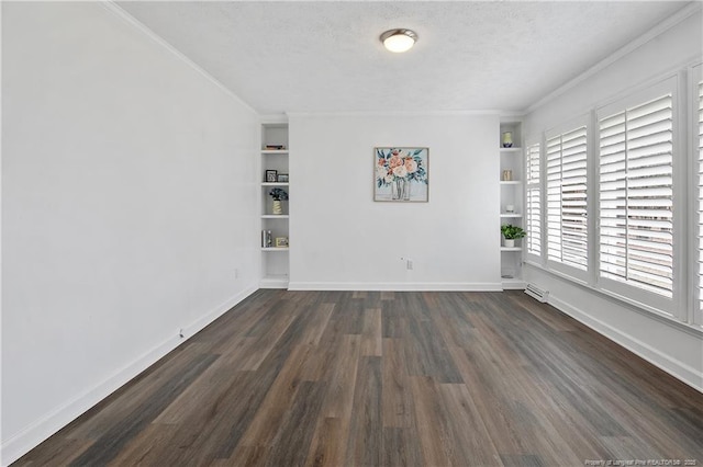 unfurnished room with built in shelves, crown molding, dark wood-type flooring, and a textured ceiling