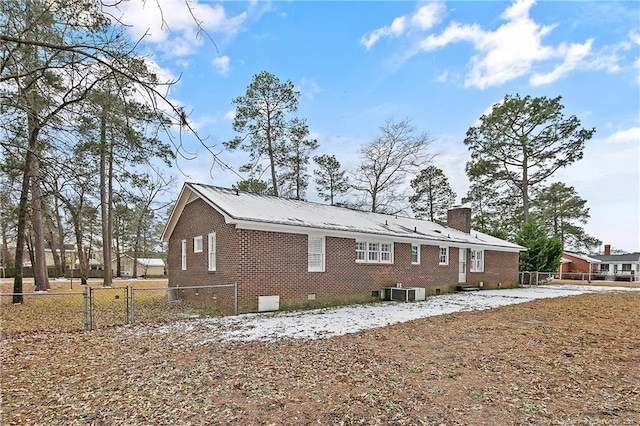 view of side of property with central AC