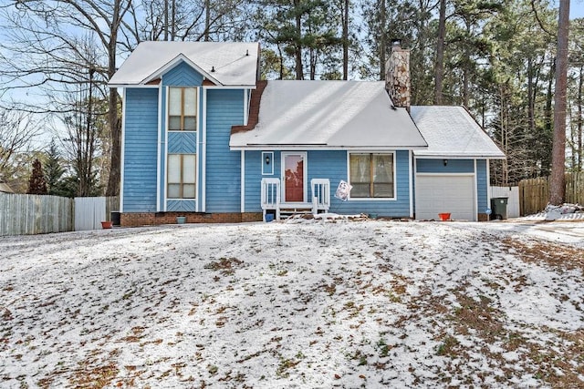 front facade with a garage