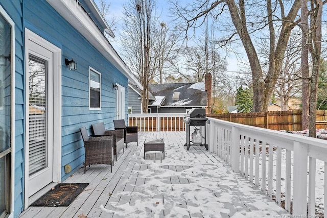 wooden terrace featuring a grill