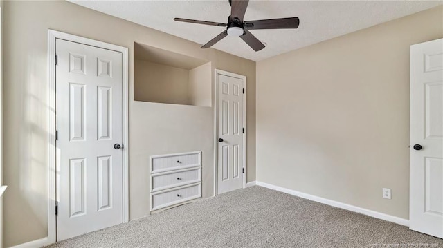 unfurnished bedroom with carpet and ceiling fan