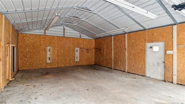 garage featuring wood walls