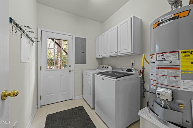 clothes washing area with light tile patterned floors, water heater, electric panel, independent washer and dryer, and cabinets