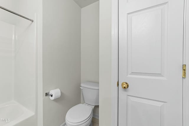 bathroom featuring toilet and shower / bathing tub combination