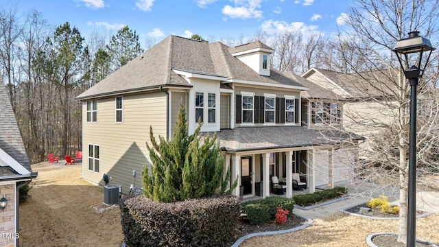 view of front of home featuring a patio and central air condition unit