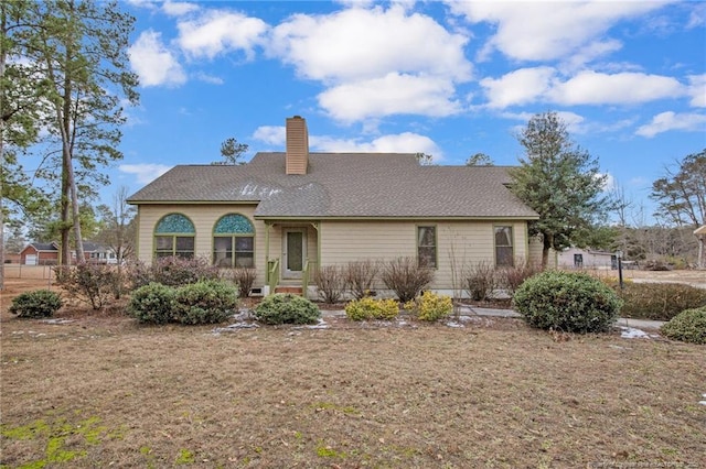 back of house with a yard