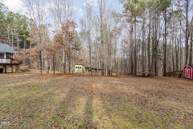 view of yard with a wooden deck