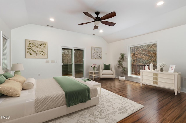 bedroom featuring vaulted ceiling, access to outside, multiple windows, and dark wood finished floors